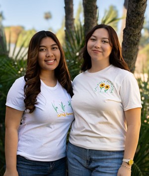 LADIES TEE PINK FLOWERS OVER SCRIPT WHITE